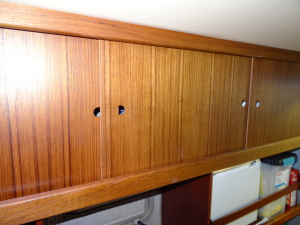 We added a doors to the shelving on the port side between the stateroom and the head. 